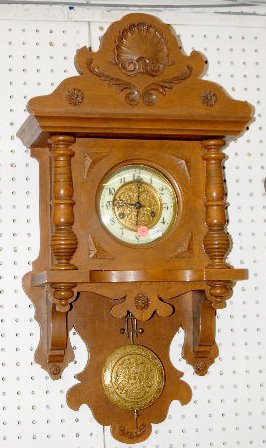 Carved German Free Swinger Wall Clock — Antique Clocks Price Guide
